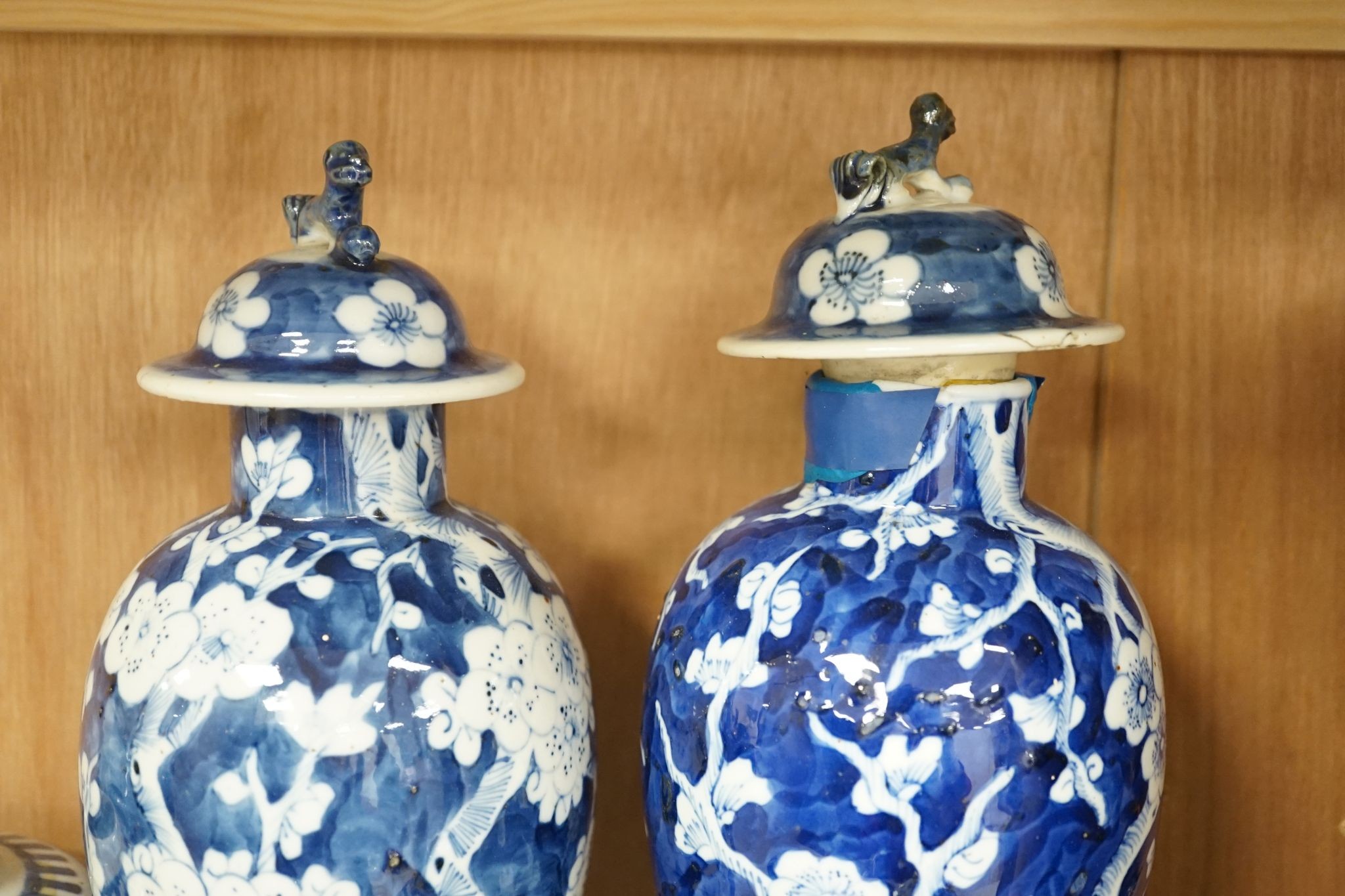 A pair of Chinese blue and white vases and eleven jars, six with covers., Vase and matching cover 28 cms high.